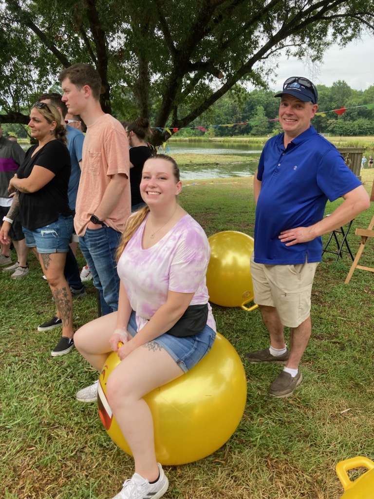 Woman on a boucey ball at corporate outing