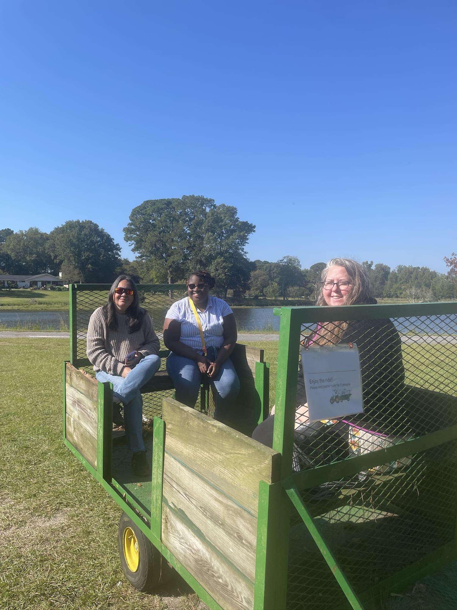 Three women on a tobacco trailer