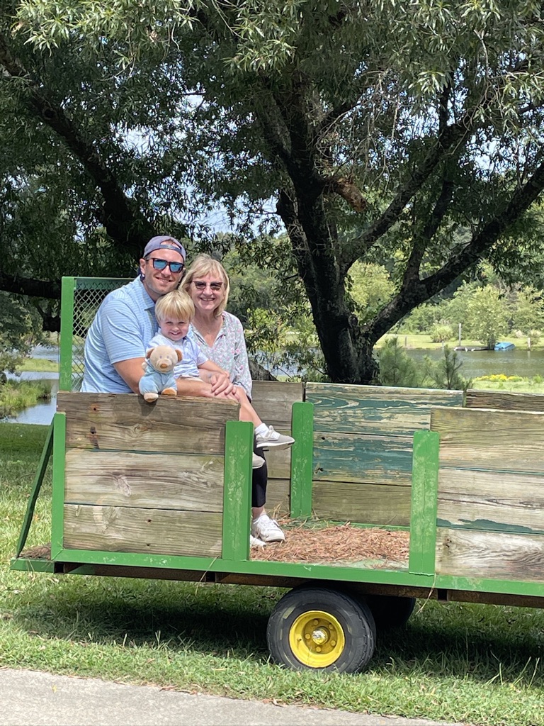 Woman man and child on tobacco trailer