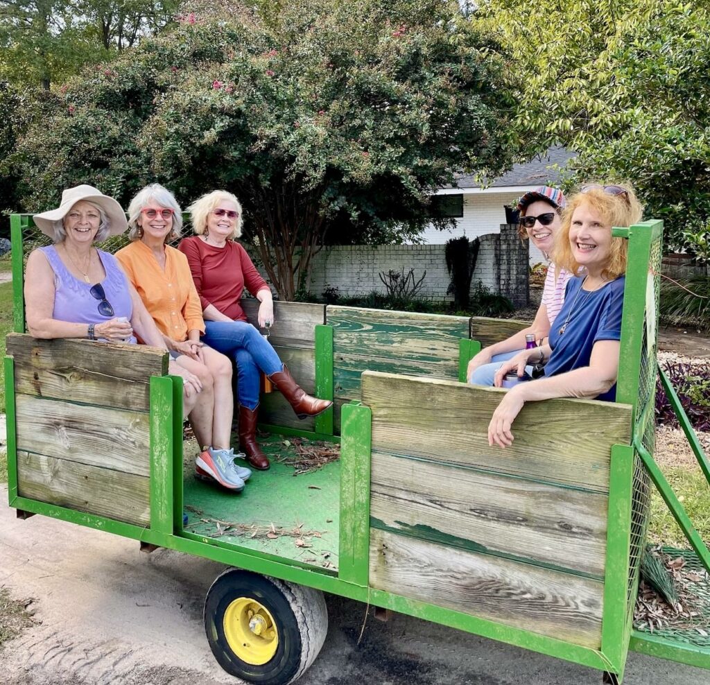 Five women on a tobacco trailer