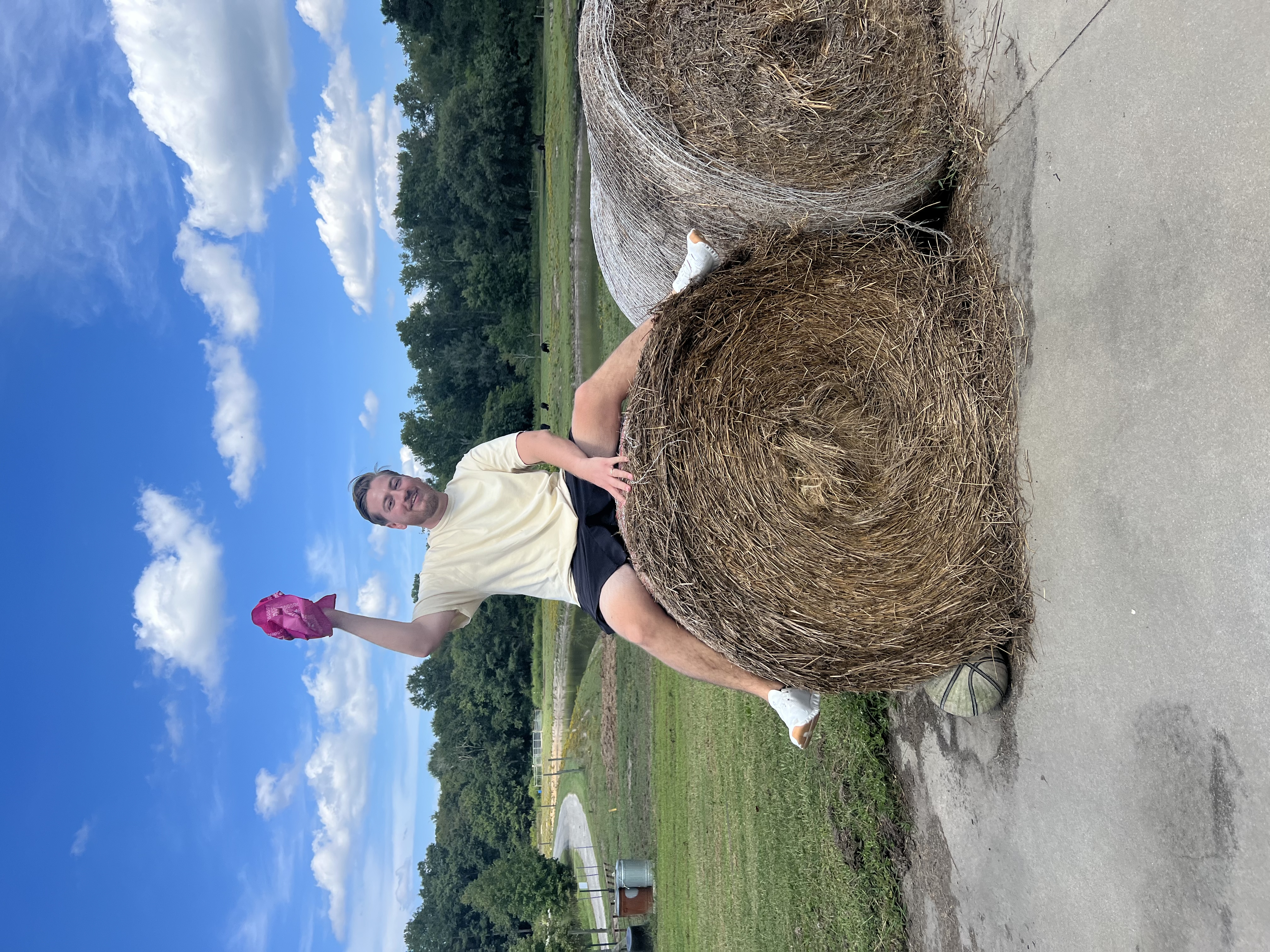 Climb on a round bale of hay